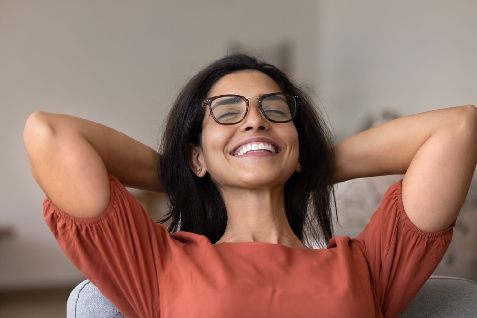happy, calm woman sitting in a dental chair